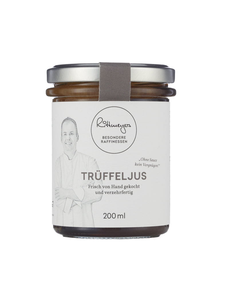 Ein 200-ml-Glas TRÜFFELJUS ab 15. November von Rittmeyers Besondere Raffinessen, mit weißem Etikett und Illustration des Küchenchefs - ideal, um der Gourmetküche ein exquisites Trüffelaroma zu verleihen.