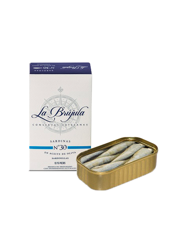 Eine Schachtel SARDINEN IN OLIVENÖL N°30 VON LA BRUJULA von LA BRUJULA wird neben eine offene Dose gestellt.