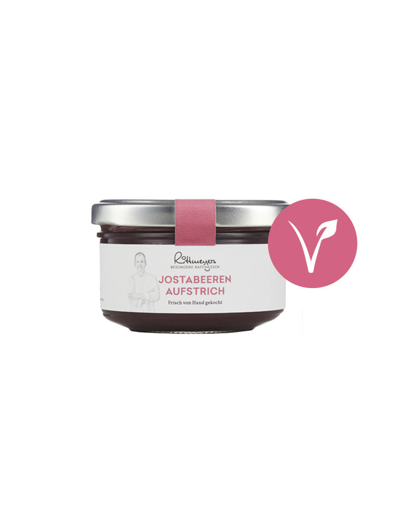 Ein Glas JOSTABEEREN-AUFSTRICH von Rittmeyers Besondere Raffinessen mit veganem Symbol auf der rechten Seite – diese handgefertigte Produkt-Innovation bietet puren Fruchtgenuss.